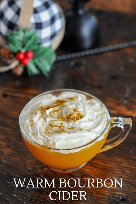 This Bourbon Apple Cider Cocktail is full of flavor with lemon juice, maple syrup, bourbon, and apple cider. Full of fall and winter flavors topped with whipped cream, this warm cocktail is a great choice for parties and easy to make in a slow cooker! #cocktails #whiskey #apple Cider Alcohol Drinks, Apple Cider Alcohol, Hot Apple Cider Cocktail, Hot Apple Cider Recipe, Bourbon Cider, Apple Cider Bar, Cider Cocktail Recipes, Bourbon Apple Cider, Warm Cocktails