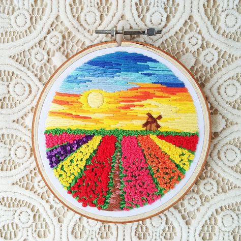 Imagine walking among the tulip fields or just standing on one end of the field and looking at beautiful, colorful flowers as far as your eyes can reach. Tulip Field Embroidery, Field Embroidery, Sunset Embroidery, Hoop Art Embroidery, Landscape Embroidery, Tulip Field, Tulip Fields, Art Embroidery, Embroidery Hoop Art