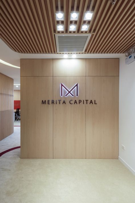 Merita Capital Offices - Hanoi - Office Snapshots Reception Logo Wall Design, Office Reception Design Entrance, Logo Wall Design Office Branding, Office Logo Wall Design, Office Logo Wall, Logo Wall Design, Executive Office Design Interior, Office Signage Design, Reception Waiting Area