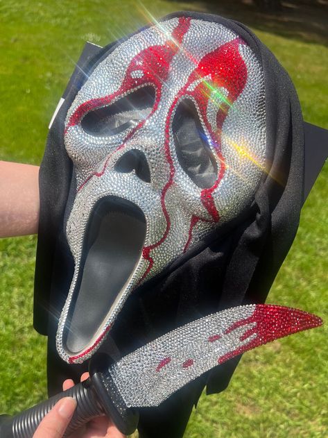 WILL BE OUT OF TOWN SEPTEMBER 9TH-24TH! I WILL SHIP EVERYTHING OUT AS SOON AS I CAN WHEN I GET BACK AND WILL KEEP YOU UPDATED ON YOUR ORDER! Handmade Bedazzled GhostFace Mask With Bedazzled Knife THIS IS MADE TO ORDER! Please wait 2-4 weeks for your order to ship out. I hand place almost 10,000 rhinestones on these items. I will also give plenty of updates and if you need it there sooner, please let me know. THERE IS A MINIMUM OF 7,000 RHINESTONES HAND APPLIED TO BOTH OF THESE COMBINED. The mask Ghostface Ideas Halloween, Bejeweled Scream Mask, Ghostface Mask Diy, Ghost Face Mask Rhinestone, Ghostface Glitter Mask, Bedazzled Halloween Mask, Bedazzled Knife, Bedazzled Ghostface Mask, Rhinestone Ghostface Mask