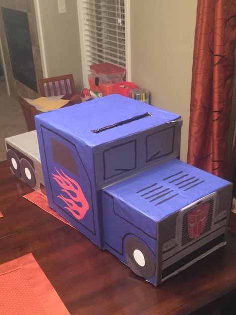 Optimus prime Valentines box Monster Truck Valentine Box, Valentine's Box Ideas, Valentine Box Unicorn, Basketball Valentine Boxes, Diy Valentine's Mailbox, Valentines Box Ideas, Diy Valentine's Box, Valentine's Boxes, Diy Valentines Box