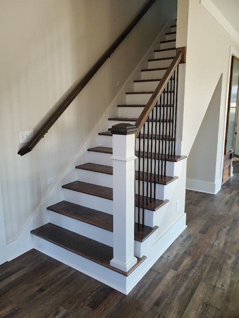 Metal balusters, and stained handrail with a square newel post. #rimakhomes Staircase Newel Post, Painted Stair Railings, Stair Railing Makeover, Pool Table Lights, Metal Stair Railing, Interior Stair Railing, Stair Posts, Stair Banister, Stair Balusters