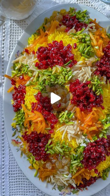 Faridah H on Instagram‎: "Persian Jewelled rice with chicken - مرصع پلو شیرازي   Ingredients: * Chicken breast  * Onion (1 large, sliced) * Garlic (2 cloves, whole) * Butter (1/2 cup) * Water (2 cups) * Saffron (a pinch, brewed in hot water) * Salt * Black pepper * Turmeric * Almonds (1/2 cup, sliced) * Pistachios (1/2 cup, slivered) * Raisins (1/2 cup) * Zeresht (dried barberry, 1/4 cup)  * Candied orange peel (1/4 cup, chopped) * Persian rice (2 cups) Instructions: In a  pot, heat some oil over medium heat. Add the sliced onion and whole garlic cloves. Season with salt, black pepper, and turmeric. Fry until the onions are softened and translucent, about 5 minutes. Add the chicken pieces and cook until golden brown on all sides. Pour in the 2 cups of water and bring to a boil. Reduce heat Persian Chicken Recipe, Slivered Almonds Recipes, Persian Chicken Barley Soup, Persian Rice With Raisins, Saffron Rice With Chicken, Persian Jeweled Rice, Persian Saffron Chicken, Persian Saffron Rice, Jeweled Rice