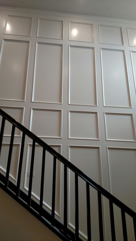 Wall Panels Stairway, Wall Panel Design Staircase, Panel Stairs Wall, White Waynes Coating Bedroom, Two Story Paneled Wall, Wood Trim Accent Wall Staircase, Wood Panel Staircase Wall, Wall Paneling On Stairs, Paneling Up Staircase