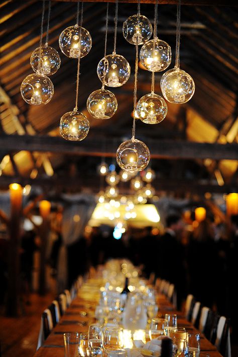 Lights hanging from the barn rafters Outdoor Wedding Chairs, Hanging Globes, Reception Ceiling, Vermont Wedding Venues, Mirror Candle Plate, Rose Wedding Decorations, Light Globes, Ceremony Candles, Candle Table Decorations