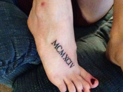 MCMXCIV - 1994 - Roman Numerals - Tattoo - Foot Tattoo Roman Numerals Tattoo, Numerals Tattoo, Tattoo Font Styles, Thigh Tattoo Men, Cute Foot Tattoos, Liberty Tattoo, Tattoo Foot, Patriotic Tattoos, Roman Numeral Tattoos