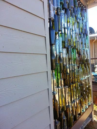 DIY Bottle Wall Idea | Hometalk Rustic Chic Wall Decor, Sea Glass Window Art, Wine Bottle Wall, Bottle Trees, Empty Wine Bottles, Wine Bottle Art, Bottle Garden, Bottle Wall, Metal Tree Wall Art