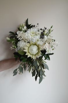 White Protea Bouquet Wedding, White Protea Bouquet, White Dahlia Wedding Bouquets, Ruscus Bouquet, Protea Bouquet Wedding, White King Protea, White Protea, White Wedding Flowers Bouquet, White And Green Bouquet