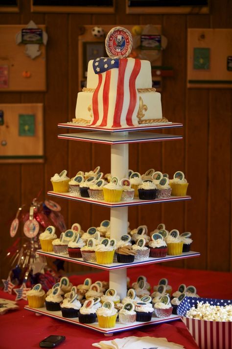 Eagle Scout Display  Cupcake tower for my son's Eagle Scout ceremony. Many thanks to PattyT, not only for the idea of making toppers of badges on chocolate discs but also her instructions for making the cupcake tower. All based on her photos here in the gallery. Cake pops are eggless chocolate chip cookie dough dipped in Merkens. Oh-so-glamorous pegboard stand propped on Scout handbooks. Eagle Scout Display, Pegboard Stand, Eagle Court Of Honor, Eagle Scout Cake, Chocolate Chip Cookie Dough Dip, Eagle Ceremony, Boy Scouts Eagle, Eagle Scout Ceremony, Court Of Honor