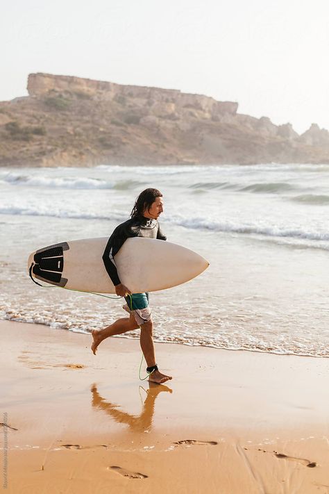 Surfer running at the sandy beach, next to the water, holding his surfboard - summer time in Malta Person Running, Scientific Illustration, Man Running, Summer Time, Surfboard, Surfing, Royalty Free Stock Photos, Running, Water