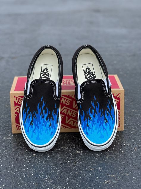 Navy blue, bright blue, neon blue flame fire tip Slip On Vans Shoes. We buy each pair of shoes BRAND NEW. Each pair is made to order, please make sure you put in the correct shoe size before you check out. The ink is permanent and will never come off, fade away, or peel off. Made in the USA. This price includes everything: shoes, artwork, and shipping. Thanks for stopping by our Etsy shop! Please message me with any questions! Because the artwork is custom made for you, there are no exchanges or Painted Shoes For Men, Painted Vans Slip On, Flame Shoes, Leather Drawing, Unique Vans, Shoes Artwork, Spongebob Musical, Vans Custom, Gold Vans