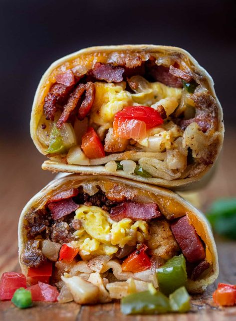 A Cowboy Breakfast Burrito is a savory and hearty breakfast option loaded with meats, vegetables, seasonings, eggs, and cheese wrapped in a tortilla and pan-fried to perfection! It is sure to satisfy even the biggest appetites and keep you going all morning. Ultimate Breakfast Burrito, Cowboy Breakfast Burrito, Breakfast Ideas For Restaurant, Steak Breakfast Burrito, Unique Breakfast Ideas, Burritos Recipes, Cowboy Breakfast, Tortilla Pan, Easy Breakfast Burritos