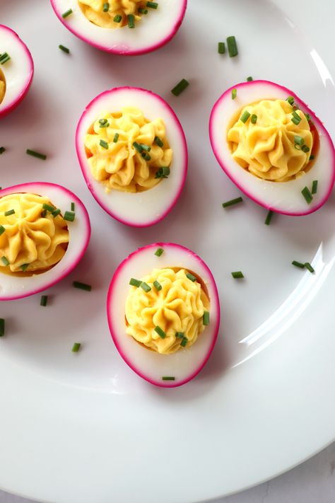 Beet Pickled Deviled Eggs are a gorgeous twist on deviled eggs. Naturally dyed with beet and quick pickled for a little bite of acidity. It takes that ol’ deviled egg recipe to the next level. #easter #deviledeggs #easyrecipes Red Beet Deviled Eggs, Beet Deviled Eggs, Paleo Deviled Eggs, Pickled Deviled Eggs, Entertaining Food, Chicken Meatball Recipes, Summer Eats, Pickled Eggs, Avocado Egg Salad