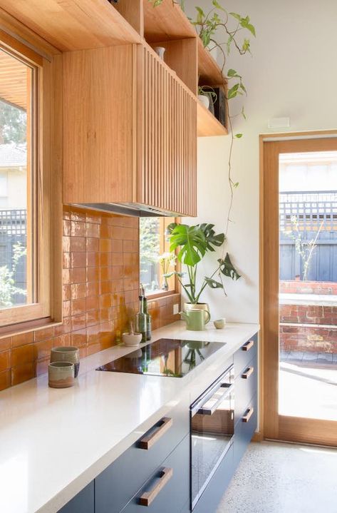 A Cramped Bungalow Is Reborn as an Eco-Minded Home for Two Gardeners - Dwell Colourful Grout Kitchen, Coloured Tile Splashback Kitchen, Pop Of Colour Kitchen, Gully Kitchen, 70s Inspired Kitchen, Colourful Kitchen Ideas, Coloured Kitchens, Abi Bathrooms, Kitchen Color Orange