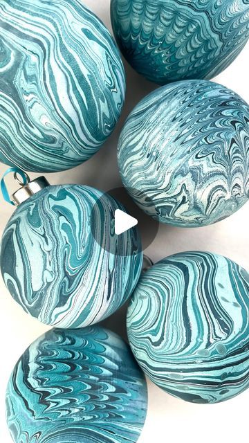 Mercedez Rex on Instagram: "Y’all I’m popping up this weekend and I’m bringing a DIY marbled ornament station for you to dip dye your own ceramic baubles 🤗 It’s gonna be cute! This Sunday Dec 10th 12-5 at @hotelmagdalena" Marbled Baubles Diy, Diy Marbled Ornaments, Marbling Ornaments Diy Christmas, Diy Painted Baubles, Paint Dipped Ornaments, Diy Ceramic Baubles, Decorating Christmas Baubles, Diy Christmas Baubles Craft Ideas, Marbelized Ornaments