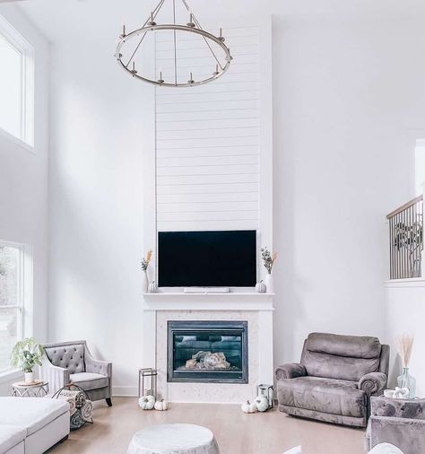 38 Modern Shiplap Fireplace Ideas to Suit Many Different Interior Styles Modern Shiplap Fireplace, Shiplap Fireplace Ideas, Different Interior Styles, Modern Shiplap, Black Fireplace Surround, Beach Fireplace, Gray Shiplap, Installing Shiplap, Wooden Mantel