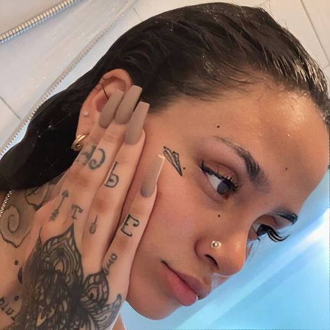 Kehlani Tattoo Ideas, Kehlani Face, Kehlani Tattoo, Yg Tattoos, Small Face Tattoos, Paper Plane Tattoo, Kehlani Parrish, Plane Tattoo, Behind Ear Tattoos