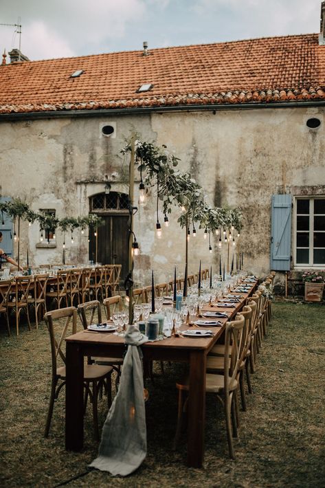 Eucalyptus garlands on Edison  lights for this French country destination wedding Villa Style Wedding, Farmhouse Style Wedding, French Countryside Table Setting, Potted Flower Wedding, Country French Wedding, Edison Lights Wedding, Rustic French Farmhouse, A Night In Tuscany Theme, Timeless Country Wedding