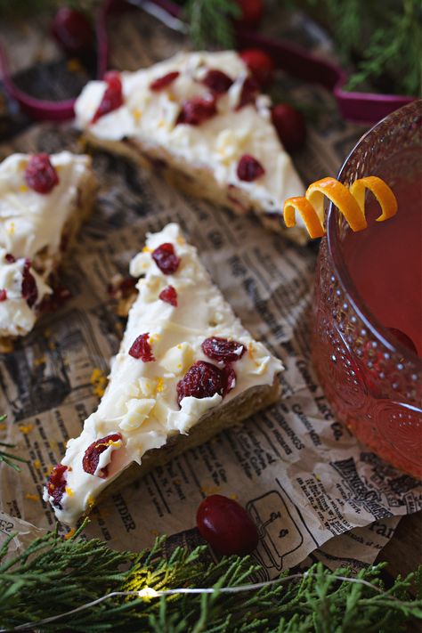 Make the holidays extra special with these homemade Cranberry Bliss Bars! This copycat Starbucks recipe features a dense blondie base filled with tart cranberries, fresh ginger, and a hint of orange zest. Topped with a creamy cream cheese frosting and a decadent white chocolate drizzle, these bars are the perfect holiday treat for gifting or sharing at festive gatherings. Easy to store and great for baking ahead—get the recipe for these holiday favorites now! Recipes Using Starbursts, Holiday Blondies Recipe, Starbucks Bliss Bars Recipe, Festive Treats Christmas, Starbucks Cranberry Bliss Bars Copycat, Starbucks Cranberry Bliss Bars, Starbucks Cranberry Bliss, Christmas Bars, Bakery Inspiration