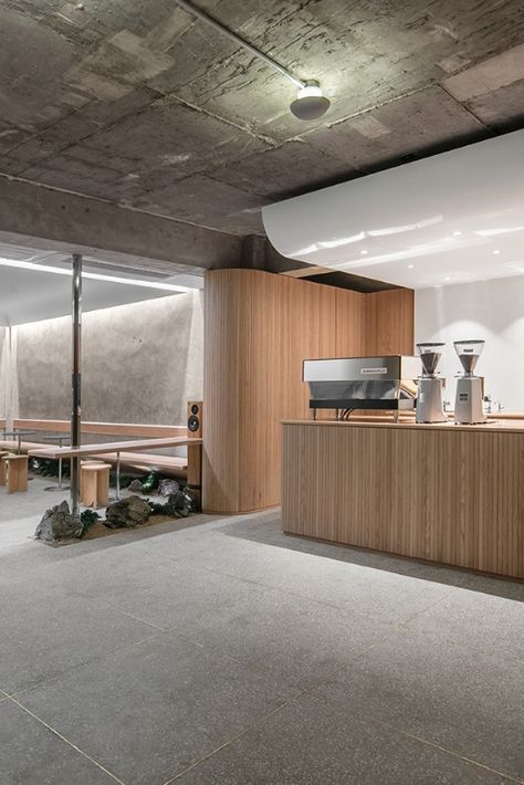 Sleek design is paired with traditional Korean elements at Cafe Oriente in Seoul’s creative Itaewon neighbourhood. Designed by local practice, Labotory, the cafe is partially submerged into the ground and features a combination of raw concrete, untreated wood, gravel, rock and a touch of greenery.

Photography: Yongjoon Choi

#southkorea #seoul #cafe #minimalistdesign #minimalism #design #travel #concrete #interior #interiors #interiorstyle Korean Coffee Shop, Minimal Cafe, Cafeteria Design, Wood Cafe, Concrete Interiors, Cafe Shop Design, Modern Restaurant, Coffee Shop Design, Cafe Interior Design