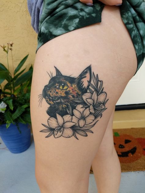 Tortoiseshell cat portrait tattoo with black and white flowers Cat Tattoo Tortoiseshell, Tortoise Cat Tattoo, Torti Cat Tattoo, Tortoise Shell Cat Tattoo, Tortoiseshell Cat Tattoo, Tortishell Cat Tattoos, Cat Flowers Tattoo, Cat Tattoo Flowers, Tortie Cat Tattoo