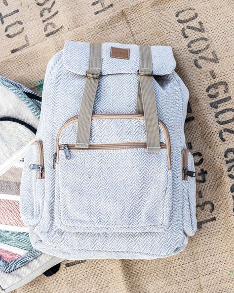 Handcrafted by hemp artisans in the heart of Kathmandu Nepal, these rugged hemp rucksacks are both gorgeous as well as functional. This bag, with a design that features more muted patterns, highlights the beautiful simplicity of the hemp while the sturdy design makes full use of its strength and durability. The design provides plenty of room for your day to day and school related necessities, with a large inner compartment along with two small outer- side pockets and two front pockets, and adjus Eco-friendly Canvas Backpack For Travel, Eco-friendly Travel Backpack, Eco-friendly Everyday Backpack In Natural Color, Small Hiking Backpack, Hemp Backpack, School Laptop, Boho Backpack, Hemp Bag, Vegan Travel