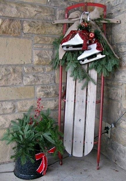 The website (below) has ideas for using old wooden sleds and sleighs to decorate a porch or front yard for Christmas. THINGS TO ADD sled ice skates snow skis metal watering can metal bucket wooden sign - Believe, Peace, Joy, etc small fir tree in metal bucket or festive planter child's wagon filled with gifts wooden woodland animal statue (deer, bear) metal lantern (battery operated light ?) blanket snow shovel with festive bow burlap decor holly branches pine cones knit stocking hat mittens Winter Outdoor Decorations, Christmas Sled Decoration, Georgia Christmas, Sled Decor, Wooden Sled, Outdoor Christmas Diy, Christmas Sled, Farmhouse Style Christmas, Christmas Front Porch