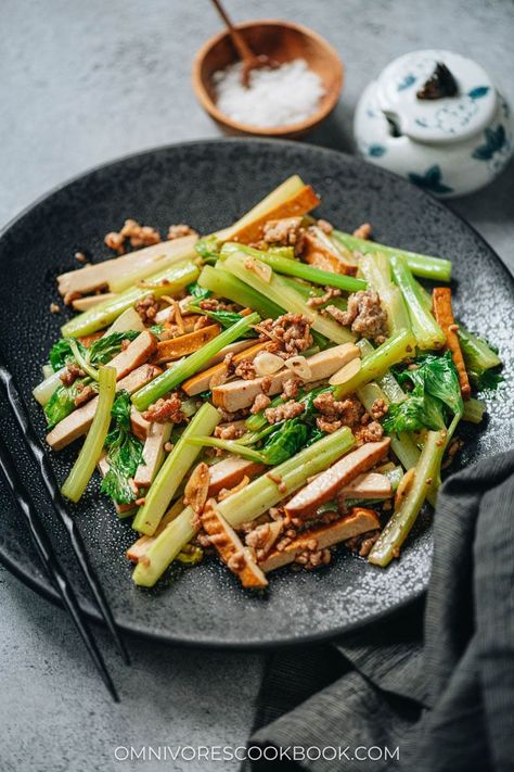 Dried tofu and celery stir fry is a satisfying and healthy main dish that you can put together in no time. The crunchy celery and chewy smoked tofu are cooked with a small amount of ground pork to enhance their flavor, along with ginger, garlic and soy sauce. It’s super easy to make and tastes very satisfying! {Gluten-Free Adaptable, Vegetarian Adaptable} Celery Stir Fry, Vegetarian Ham, Dried Tofu, Smoked Tofu, Vegetarian Oyster Sauce, Meat Replacement, Stir Fry Ingredients, Quick Stir Fry, Tofu Stir Fry