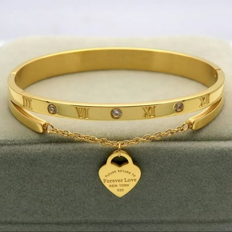 Gold Color Hanging Heart Label Forever Love Titanium Steel Bangle&Bracelets #jewelrydesigner #jewelry #jewellery #jewelrydesign #jewelrylovers #bracelet #gold #diamond #silver Hanging Hearts, Bracelet Gold, Forever Love, Gold Diamond, Bangle Bracelets, Gold Color, Jewelry Design, Bangles, Bracelet