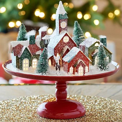 10 Ways to Jump-Start Your Home’s Holiday Spirit Christmas Village On Cake Stand, Snowy Christmas Village, Mr Christmas, Snowy Christmas, Vintage Holiday Decor, Christmas Table Centerpieces, Christmas Village Display, Christmas Centerpieces Diy, Village Display