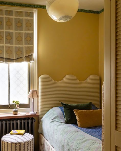 Get cosy…Jules’s tiny spare room! A white box transformed. The butter yellow walls are offset by varied greens, saturated blue, olive and lilac. Our Jaipur border in Emerald wraps the room, and our scroll stripe in plaster makes for a super pretty bedside perch. This room inspired our love of Butter and Pistachio which feature a lot in our new colours, check out our #coloursoftheseason series. Thank you @homesandgardensofficial for sharing this . Yellow Striped Wall, Tiny Spare Room, Butter Yellow Walls, Yellow Room Ideas, Yellow Kids Bedroom, Sacred Room, Yellow Kids Rooms, Kids Shared Bedroom, Room Inspired