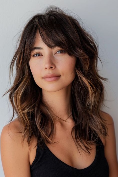 Whether you’re seeking a subtle change or a bold new look, we’ve got you covered with over 50 fabulous medium length hairstyle ideas to inspire your next salon visit or DIY hair adventure. From sleek bobs to tousled waves, vibrant hues to natural textures, you’ll find all the medium-length hair inspo you need! Let’s dive into these chic medium-length hairstyle ideas that are bound to elevate your look and leave you feeling confident and fabulous! Mid Length Hair With Bangs Side Part, Medium Length Haircut Beach Waves, Medium Textured Haircut With Bangs, Shaggy Mid Length Hair Side Part, Medium Brown Shag Hair, Shag Face Framing Layers, Side Part Collar Bone Length Hair, Round Face Haircuts Curtain Bangs, Medium Length Wolf Cut No Bangs