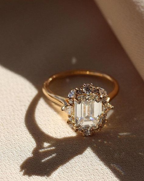 3.55 CT Emerald Cut Moissanite Diamond Engagement Ring 14K Solid Gold Vintage Emerald Cut Ring Moissanite Wedding Ring Hidden Halo Gift Ring ✥𝐒𝐭𝐨𝐧𝐞 𝐃𝐞𝐭𝐚𝐢𝐥𝐬 : * Stone Type: Moissanite * Shape: Emerald Cut * Stone Weight: 3.55 CT (Approx.) * Color: Colorless * Clarity: VVS (Eye Clean) * Cut Grade: Excellent * Making Process: Handmade - Crafted by our experienced team 𝐓𝐡𝐞 𝐬𝐭𝐨𝐧𝐞𝐬 𝐢𝐧 𝐣𝐞𝐰𝐞𝐥𝐫𝐲 𝐚𝐫𝐞 𝟏𝟎𝟎% 𝐡𝐚𝐧𝐝-𝐜𝐫𝐚𝐟𝐭𝐞𝐝 𝐢𝐭 𝐢𝐬 𝐜𝐮𝐭 𝐚𝐧𝐝 𝐩𝐨𝐥𝐢𝐬𝐡𝐞𝐝 𝐛𝐲 𝐨𝐮𝐫 𝐞𝐱𝐩𝐞𝐫𝐢𝐞𝐧𝐜𝐞𝐝 𝐜𝐫𝐚𝐟𝐭𝐬𝐦𝐚𝐧. 𝐌𝐨𝐢𝐬𝐬𝐚𝐧𝐢𝐭𝐞 𝐢𝐬 𝐚 𝐝𝐢𝐚𝐦𝐨𝐧𝐝'𝐬 𝐛𝐞𝐬𝐭 𝐚𝐥𝐭𝐞𝐫𝐧𝐚𝐭𝐢𝐯𝐞. ✥𝐒𝐄𝐑𝐕𝐈𝐂𝐄𝐒 * 100% Conflict-Free. * Easy Payment Plan. * Free Customized Engraving. * Customize Order. * Free Gift Wrapping * Free Shipping (USPS) ✥ 𝐖𝐡𝐲 𝐛? Emerald Antique Engagement Ring, Vintage Victorian Engagement Rings, Vintage Wedding Rings 1920s Antique, Vintage Engagement Rings Unique 1920s Emerald, Vintage Engagement Rings Vintage Engagement Rings Unique 1920s, Hexagon Ring Engagement, Emerald Cut Engagement Ring Gold, Emerald Cut Wedding Rings, 1920 Engagement Ring