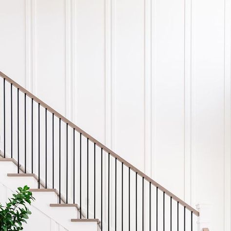 Finish trim doesn't have to be boring. Our favorite trick? Switch up patterns and styles throughout the home. This double board and batten… Board And Batten Wall Staircase, Board And Barton Stairwell, Board And Batten 2 Story Foyer, Textured Staircase Wall, Board And Batten Staircase Wall, Stairwell Board And Batten, Double Board And Batten, Staircase Board And Batten, Board And Batten Stairwell