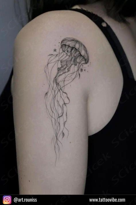 When picking the perfect water-themed tattoo, you have to think about the tattoo placement, too. With a shoulder tattoo, for example, you can count on your jellyfish having plenty of real estate to flow and move with your body. What better way to end up with a dope jellyfish tattoo?  ... daha fazla Jellyfish And Butterfly Tattoo, Jellyfish Space Tattoo, Jellyfish Knee Tattoo, Mushroom Jellyfish Tattoo, Box Jellyfish Tattoo, Jellyfish Shoulder Tattoo, Jelly Fish Tattoo Fine Line, Water Theme Tattoo, Tiny Jellyfish Tattoo