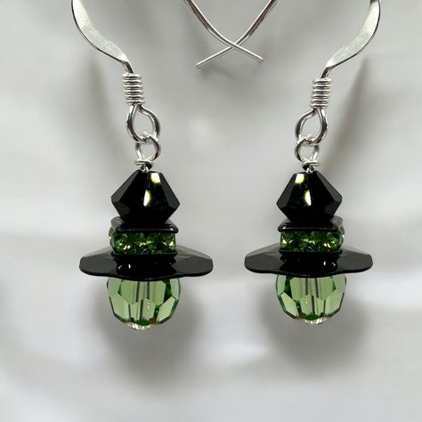 Looking for the perfect Halloween themed earrings? Look no further than Too Cute Beads Mini Witch Halloween Earrings featuring a series of crystal beads designed to create the look of the Wicked Witch!! Our jewelry kits include materials to create one finished pair of earrings and printed instructions. Not a jewelry maker? We can assemble the kit for you for $5 (There will be an option when viewing cart). Completed Length: 1 inch Materials: 2 Swarovski Bicone Bead in Jet 2 Black finish Squaredel Homemade Halloween Earrings, Diy Grinch Earrings, Halloween Handmade Jewelry, Halloween Earring Ideas, Witchy Beaded Earrings, Beaded Jewelry Ideas Handmade, Halloween Diy Earrings, Disney Beaded Earrings, Diy Halloween Earrings