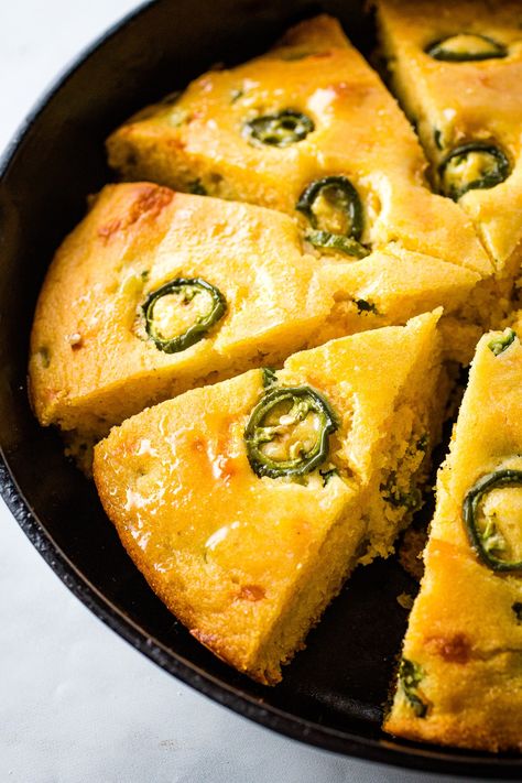 This spicy and sweet cornbread is loaded with Cheddar cheese and jalapeno peppers. Top with sliced jalapenos. Easy-to-make.   There are countless ways to make a pan of cornbread. I’d say that Cheddar Jalapeno cornbread is one of my favorites but…I’ve yet to meet a cornbread I don’t like. This easy-to-make recipe combines an equal...Read More Cheddar Jalapeno Cornbread, Pandowdy Recipe, Cheddar Cornbread Recipe, Classic Cornbread, Barbecue Dishes, Fluffy Cornbread, Jalapeno Cheddar Cornbread, Cheddar Cornbread, Jalapeño Cornbread