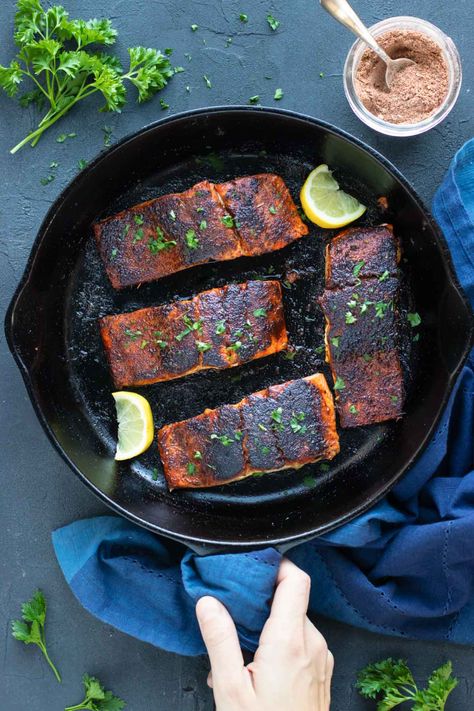 Spicy cajun Blackened Salmon is an easy recipe quickly made in under 15 minutes! Fresh filets are coated in homemade blackened seasoning, then cooked in a cast iron skillet or baked in the oven until tender and flaky. Serve this healthy main dish with rice, or roasted veggies for a low-carb dinner!#evolvingtable #blackened #salmon #keto #lowcarb Salmon Cast Iron Skillet, Homemade Blackened Seasoning, Salmon Keto, Blackened Salmon Recipes, Yellow Rice Recipes, Homemade Seasoning, Keto Salmon, Blackened Seasoning, Blackened Salmon