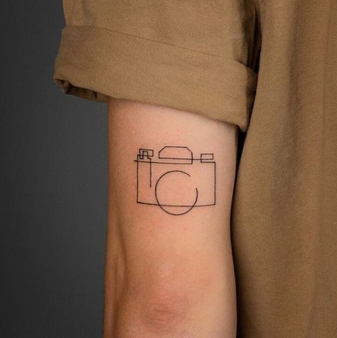 Cinematic Tattoo Ideas, Photographer Tattoo Ideas For Men, Camera Tattoo With Flowers, Small Record Tattoo, Camera Flash Tattoo, Camera Line Tattoo, Minimalist Camera Tattoo, Fine Line Camera Tattoo, Photography Tattoo Ideas Men