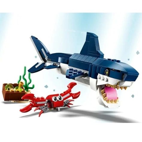 LEGO 31088 Deep Sea Creatures. Unleash your inner explorer with our Deep Sea Creatures toys! 🌊🐬 #ExploreTheDeep #toys4you Enjoy sea life adventures with the LEGO Creator 3in1 31088 Deep Sea Creatures set, featuring a scary shark toy with a realistic dark-blue and white color scheme, opening mouth full of pointy teeth, moving fins, movable body joints and reflective eyes, plus a posable crab with a box of treasure. With LEGO Creator 3in1 play sets you get 3 different build and play experienc... Reflective Eyes, Scary Shark, Pointy Teeth, Sharks Scary, Crab Toy, Dragon Boating Racing, Lego Shop, Shark Toy, Lego System