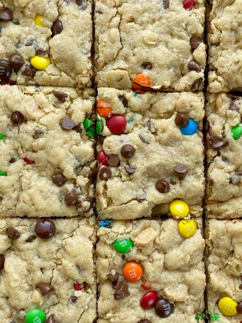 Soft-Baked Monster Cookie Bars - Together as Family Halloween Cookie Bars, Monster Cookie Bars Recipe, Leftover Halloween Candy Recipes, Mnm Cookies, Monster Cookie Dough, Oats Chocolate, Monster Cookie Bars, Monster Cookies Recipe, Monster Cookie