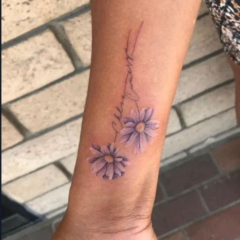 Birth Flower Tattoos: Tattoos For Every Birth Flower – MrInkwells Flower Name Tattoo, Emma Tattoo, Tattoos For Childrens Names, Aster Flower Tattoo, Small Daisy Tattoo, Aster Flower Tattoos, Two Hearts Tattoo, Daisy Tattoos, Name Flower Tattoo