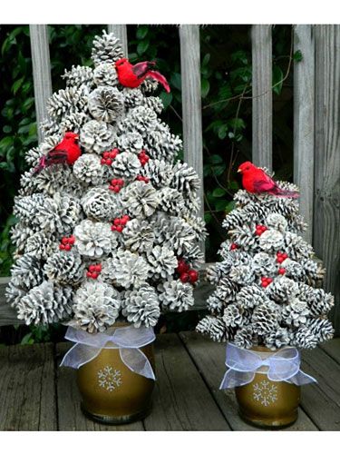 This rustic towering topiary adds understated drama to your winter décor. #pinecones #diy #crafts Pinecone Wedding, Pine Cone Christmas, Cone Christmas Trees, Creative Christmas Trees, Pine Cone Decorations, Cones Crafts, Christmas Decorations Diy Outdoor, Pine Cone Crafts, Winter Diy