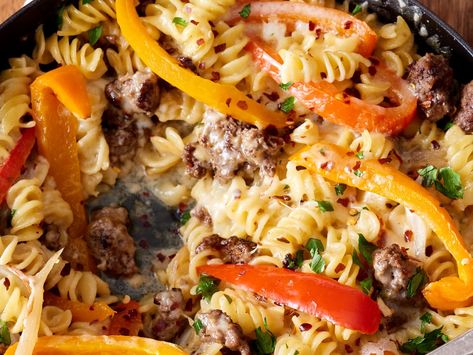 Recipe: Philly Cheesesteak Pasta Skillet | The Kitchn Chicken Philly Cheesesteak Pasta, Philly Cheesestake Pasta, Easy Philly Cheese Steak Pasta, Healthy Philly Cheese Steak Pasta, Philly Cheesesteak Pasta Skillet, Easy Green Salad, Cheese Steak Pasta, Skillet Suppers, Chicken Philly Cheesesteak