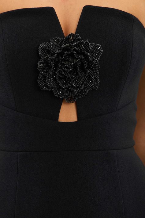 The Aubree Strapless Midi Dress in black is a classic piece with a sophisticated strapless plunge neckline. It features a hand embellished diamante floral detail in the centre of the fitted bodice, exuding timeless elegance. The pencil midi skirt and cinched waist beautifully create a flattering feminine silhouette. Fully lined and secured with a zip fastening at the back, this dress is a stunning choice for making a statement at your next event. Pencil Midi Skirt, Bridesmaid Dress Collection, Bridal Tops, Rebecca Vallance, Strapless Midi Dress, Engagement Dresses, The Pencil, Feminine Silhouette, Plunge Neckline