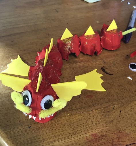 Egg Box Chinese Dragon – Lottie Makes Chinese Dragon Crafts For Toddlers, Chinese New Year Crafts For Preschoolers Dragon, Egg Box Dragon, Chinese New Year Crafts For Kids Rabbit, Paper Mache Dragon Egg, Paper Fire, Egg Box, Dragon Crafts, Foam Sheets