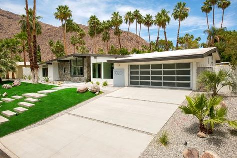 HGTV shows how a driveway of large concrete slabs surrounded by a bed of gravel leads to the garage of this midcentury modern ranch home. Midcentury Ranch, Modern Driveway, Modern Ranch House, Mid Century Exterior, Mid Century Ranch, Driveway Design, Mediterranean Style Homes, Modern House Number, Modern Ranch