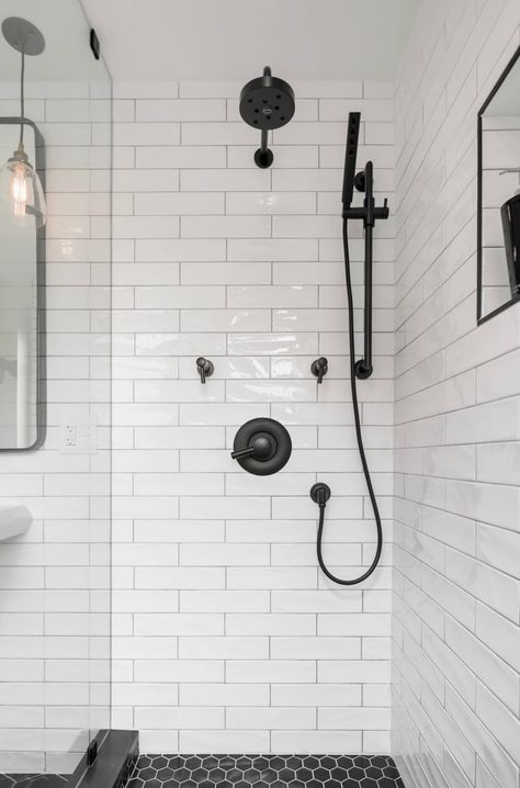 White undulating subway tile shower with black Brizo fixtures Shower Tile Black Grout, Shower Black Fixtures, Shower Tile Black, Blue And White Bathroom Ideas, White Subway Tile Shower, Blue Shower Tile, Black Bathroom Fixtures, Black Fixtures, Master Suite Bathroom