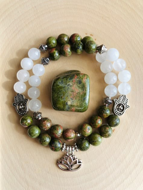 Beautiful genuine Unakite and Clear Quartz double wrap 8mm beaded gemstone bracelet, uniquely adorned with a silver Lotus charm, silver Hamsa charms, and small silver accents.  Made with 1mm elastic cord, this double wrap bracelet measures 16 inches and can stretch to fit most wrists. Handmade with love and healing energy in Franklin, Tennessee! Connect with me on Instagram! @cosmicmoonfairyjewelry Making Gemstone Bracelets, Gemstone Bracelet Ideas, Gemstone Bracelets Ideas, Crystal Bracelet Ideas, Small Bead Bracelets Ideas, Unakite Bracelet, Handmade Jewelry Ideas, Gem Stone Bracelet, Handmade Jewelry Business