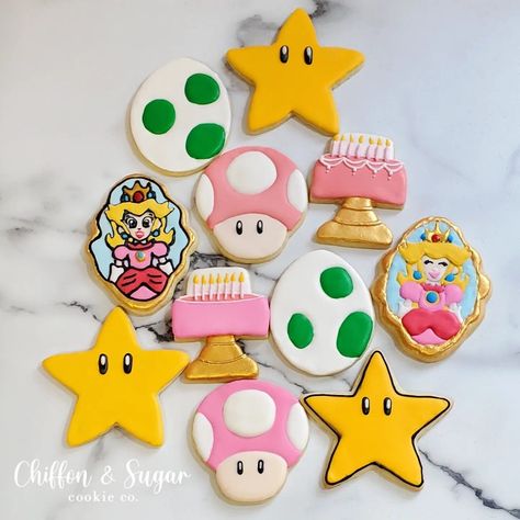 custom birthday party sugar cookies,  pink Mario theme, princess peach, royal icing Peaches Birthday Theme Mario, Princess Peach Birthday Cupcakes, Princess Peach Treats, Princess Peach Birthday Party Diy, Princess Peach Sugar Cookies, Princess Peach Cookies Decorated, Girly Mario Birthday, Princess Peach Dessert Table, Princess Peach Bday Party